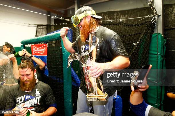 Justin Turner of the Los Angeles Dodgers celebrates in the clubhouse after defeating the Chicago Cubs 11-1 in game five of the National League...