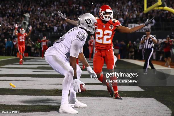 Marcus Peters of the Kansas City Chiefs reacts after a pass interference call in the endzone against Michael Crabtree of the Oakland Raiders during...