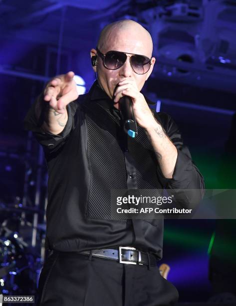Pitbull performs during the 2017 CareOne Masquerade Ball for Puerto Rico Relief Effort at Skylight Clarkson North on October 19, 2017 in New York...