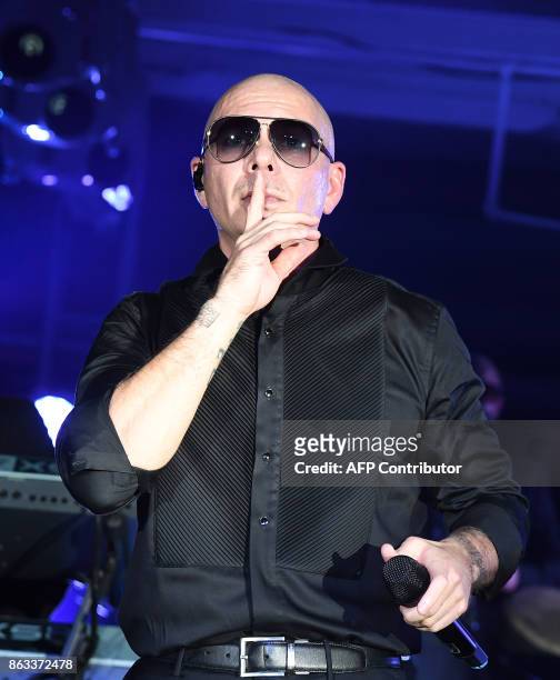 Pitbull performs during the 2017 CareOne Masquerade Ball for Puerto Rico Relief Effort at Skylight Clarkson North on October 19, 2017 in New York...