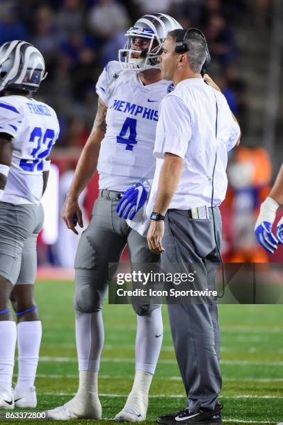 Memphis Tigers head coach Mike Norvell talks with Memphis Tigers quarterback Riley Ferguson during a second half timeout during the football game...