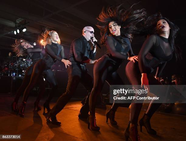 Pitbull performs during the 2017 CareOne Masquerade Ball for Puerto Rico Relief Effort at Skylight Clarkson North on October 19, 2017 in New York...