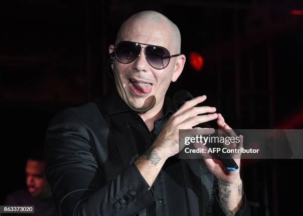 Pitbull performs during the 2017 CareOne Masquerade Ball for Puerto Rico Relief Effort at Skylight Clarkson North on October 19, 2017 in New York...