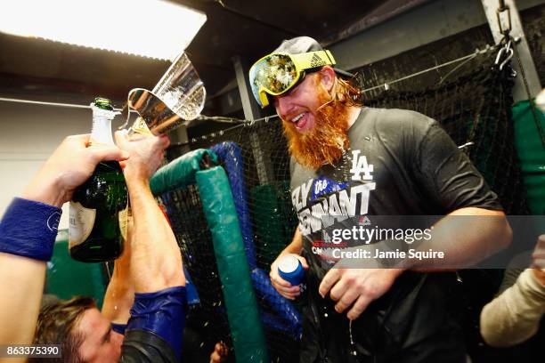 Justin Turner of the Los Angeles Dodgers celebrates in the clubhouse after defeating the Chicago Cubs 11-1 in game five of the National League...