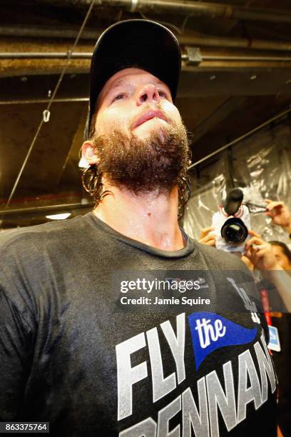 Clayton Kershaw of the Los Angeles Dodgers celebrates in the clubhouse after defeating the Chicago Cubs 11-1 in game five of the National League...