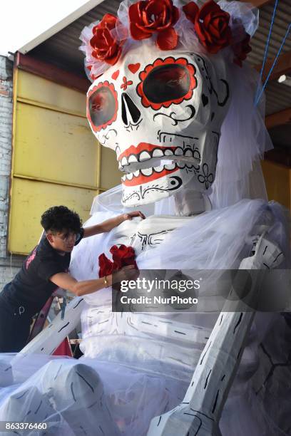 Workers of the 'Taller el Volador' made the manufacture of skulls and catrinas that will be used for the Day of the Dead Parade inspired by the most...