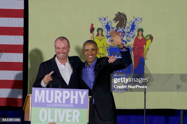 Former U.S. President Barack Obama walks on stage in support of Democratic candidate Phil Murphy, who is running against Republican Lt. Gov. Kim...