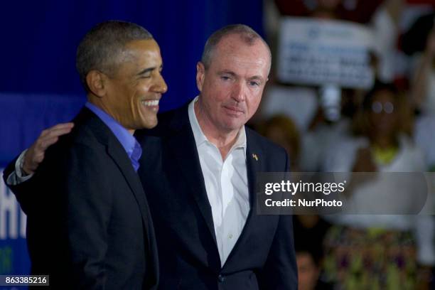 Former U.S. President Barack Obama walks on stage in support of Democratic candidate Phil Murphy, who is running against Republican Lt. Gov. Kim...