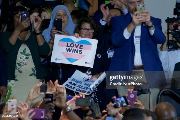 People cheer and take pictures as Former U.S. President Barack Obama speaks at a rally in support of Democratic candidate Phil Murphy, who is running...