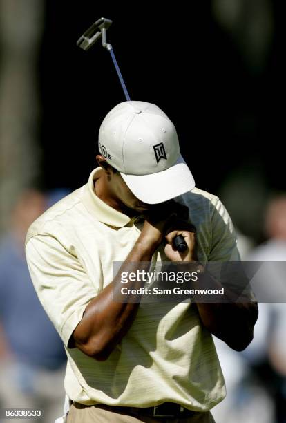 Tiger Woods reacts to a missed birdie attempt on the 11th hole during the third round of the Deutsche Bank Championship held at the TPC Boston in...