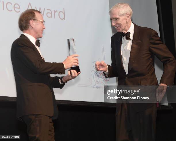 Neil Bush gives the Tribute Award to Ambassador C. Boyden Gray at the 2017 Points of Light Gala at the French Embassy on October 19, 2017 in...