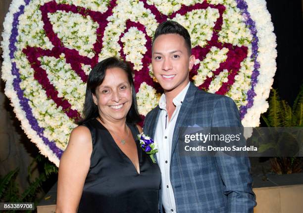 Gena Calderon and guest at Living Beauty "The Gift" Photo Exhibit at The Buterbaugh Gallery on October 19, 2017 in Los Angeles, California.