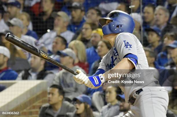 Enrique Hernandez hits a grand slam in the third inning of the Los Angeles Dodgers' 11-1 victory over the Chicago Cubs in Game 5 of the National...