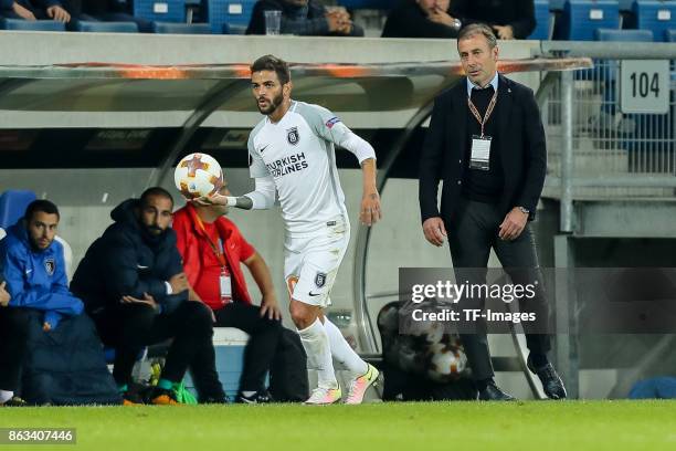 Junior Caicara of Istanbul Basaksehir controls the ball Head coach Abdullah Avci of Istanbul Basaksehir looks on during the UEFA Europa League Group...