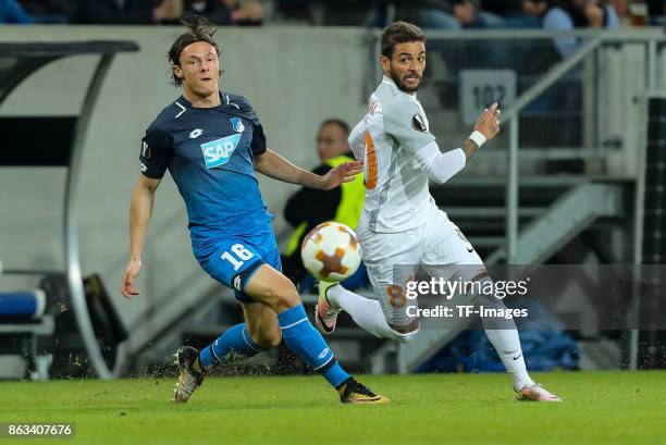 Nico Schulz of Hoffenheim and Junior Caicara of Istanbul Basaksehir battle for the ball during the UEFA Europa League Group C match between 1899...
