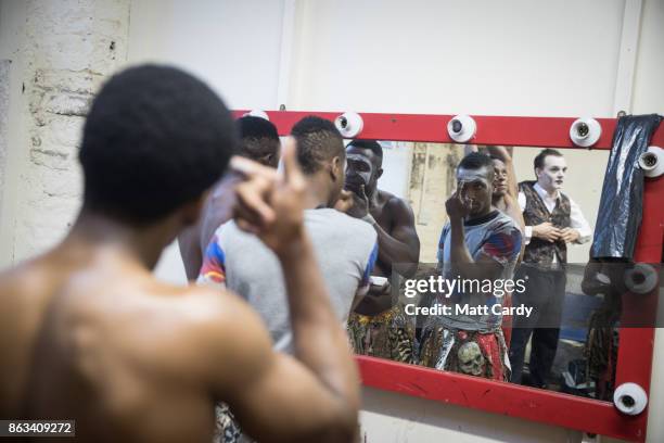 Cast members get ready prior to a rehearsal of the Circus of Horrors' latest show Voodoo, ahead of Halloween, at the Wookey Hole Caves Theatre near...