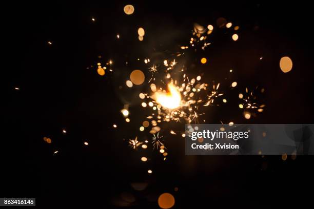 firework spark in high speed with black background - vonk stockfoto's en -beelden