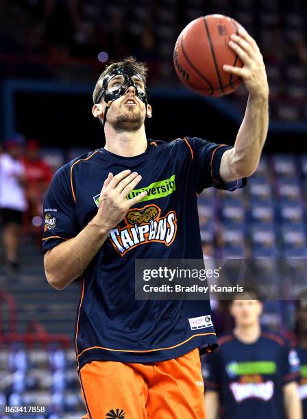 Alex Loughton of the Taipans in action during the warm-up before the round three NBL match between the Brisbane Bullets and the Cairns Taipans at...