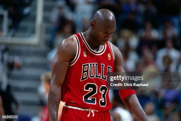 Michael Jordan of the Chicago Bulls walks off the court during Game Five of the 1997 NBA Finals played against the Utah Jazz on June 11, 1997 at the...