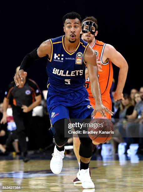 Stephen Holt of the Bullets breaks away from the defence during the round three NBL match between the Brisbane Bullets and the Cairns Taipans at...