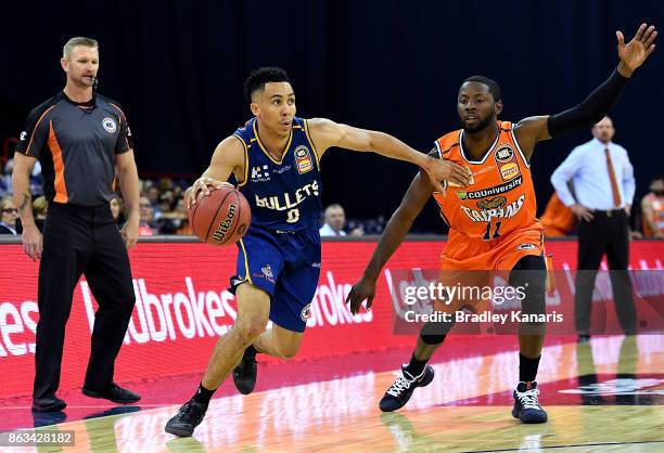 Travis Trice of the Bullets takes on the defence during the round three NBL match between the Brisbane Bullets and the Cairns Taipans at the Brisbane...