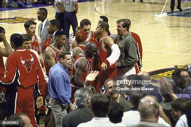 Finals: Chicago Bulls Scottie Pippen helping teammate Michael Jordan walk off court during Game 5 vs Utah Jazz. Jordan had a stomach virus that...