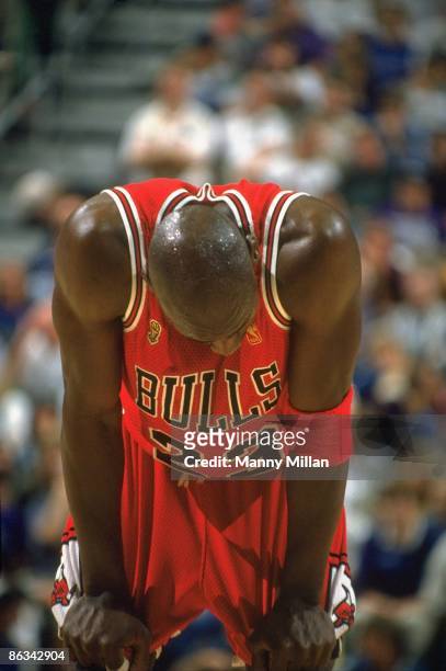 Finals: Chicago Bulls Michael Jordan with head down on court during Game 5 vs Utah Jazz. Jordan had a stomach virus that caused a fever and...