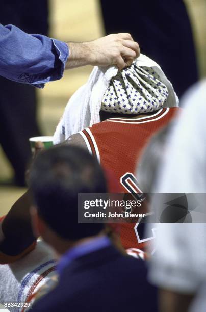 Finals: Rear view of Chicago Bulls Michael Jordan on sidelines bench with ice pack on back of neck during Game 5 vs Utah Jazz. Jordan had a stomach...