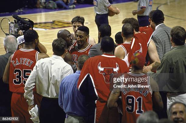 Finals: Chicago Bulls Scottie Pippen helping teammate Michael Jordan walk off court during Game 5 vs Utah Jazz. Jordan had a stomach virus that...