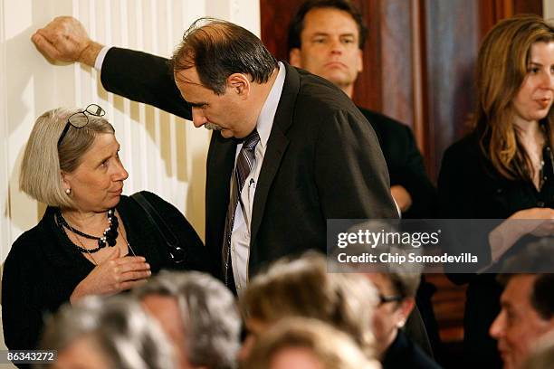 Interim White House Communications Director Anita Dunn talks with White House Senior Advisor David Axelrod before the start of a swearing-in ceremony...