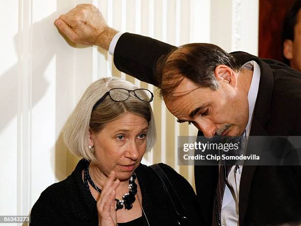 Interim White House Communications Director Anita Dunn talks with White House Senior Advisor David Axelrod before the start of a swearing-in ceremony...