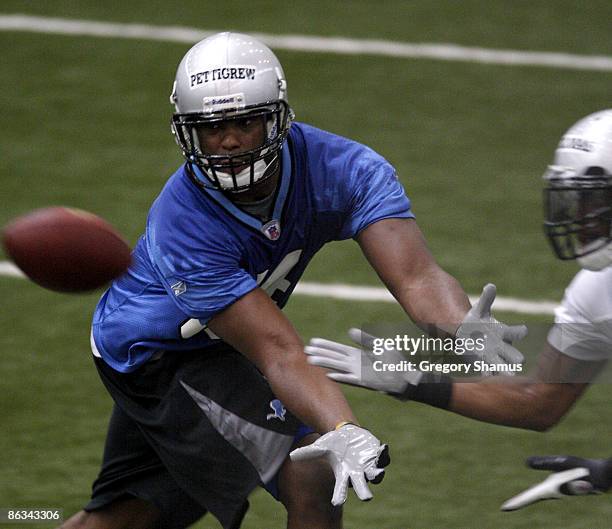 Brandon Pettigrew of the Detroit Lions tries to catch a pass during rookie orientation camp at the Detroit Lions Headquarters and Training Facility...