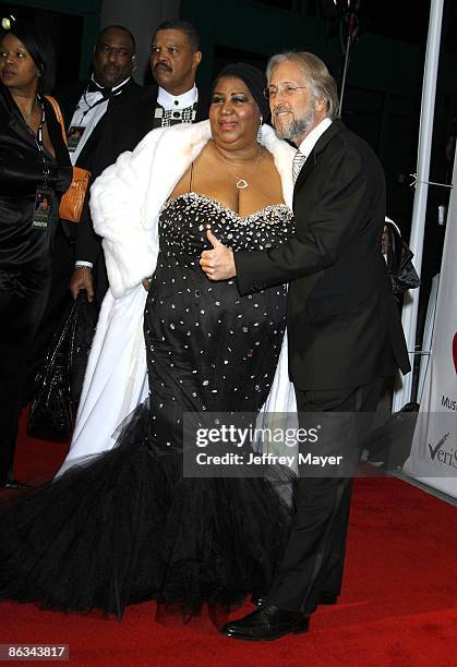 Singer Aretha Franklin and MusiCares Foundation President Neil Portnow arrive at the 2008 MusiCares Person of the Year gala honoring Aretha Franklin...