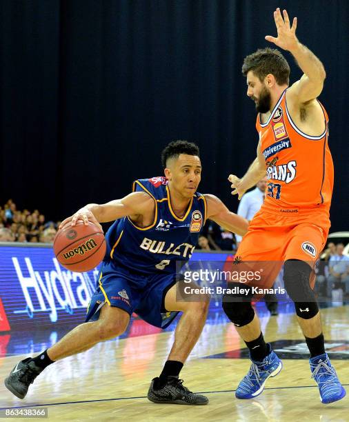 Travis Trice of the Bullets takes on the defence during the round three NBL match between the Brisbane Bullets and the Cairns Taipans at Brisbane...