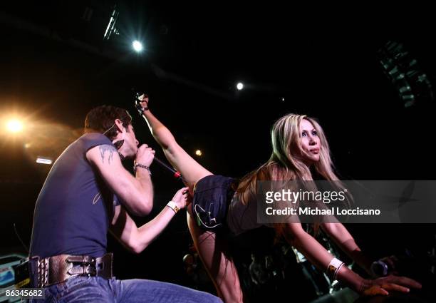 Singer Perry Farrell and wife Etty Lau Farrell perform during the Road Recovery Benefit Concert 2009 at Nokia Theatre Times Square on May 1, 2009 in...