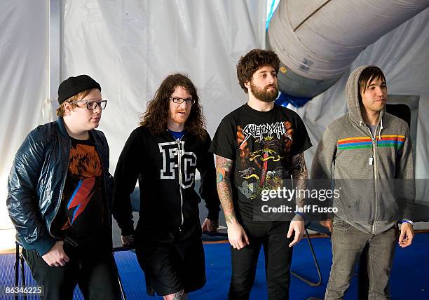 Patrick Stump, Andy Hurley, Joe Trohman and Pete Wentz of Fall Out Boy pose at a meet and greet at the mtvU Movies and Music Festival at the Festival...