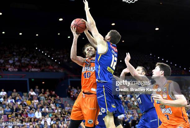 Alex Loughton of the Taipans drives to the basket during the round three NBL match between the Brisbane Bullets and the Cairns Taipans at the...