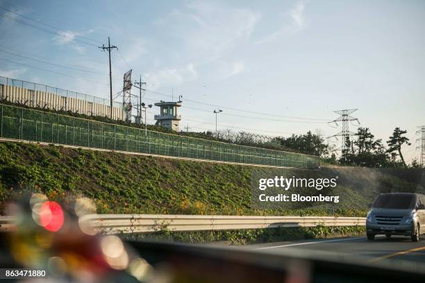 Guard post stands next to transmission towers near the temporarily suspended construction site of the Shin Kori No. 5 and 6 nuclear power reactors,...