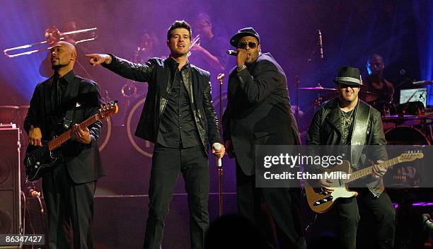 Bassist Greg Malone, singer Robin Thicke, musical director/keyboardist Larry Cox and guitarist Andrew McKay perform at The Pearl concert theater at...