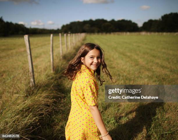 a 8 years old girl in the countryside - 8 years stock-fotos und bilder
