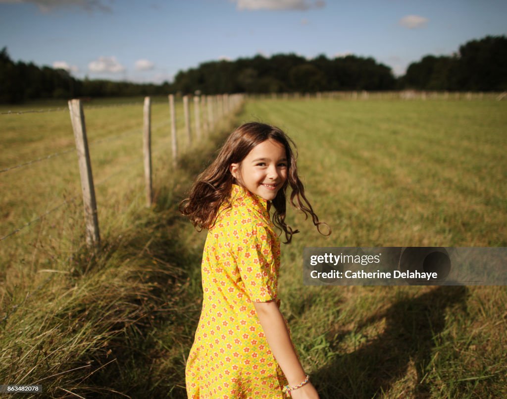 A 8 years old girl in the countryside