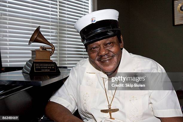 Fats Domino poses after accepting his Grammy Lifetime Achievement Award presented by the Recording Academy's Angelia Bibbs-Sanders at a ceremony to...