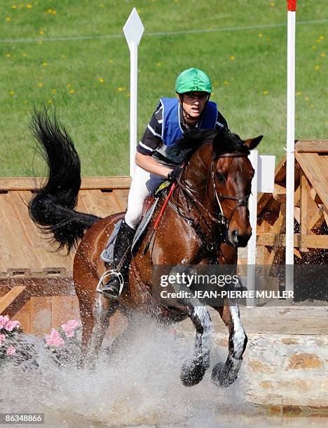 French rider Nicolas Touzaint competes on his horse Lesbos during the cross event of the Pro Elite Grand Prix, the French equistrian championship, on...