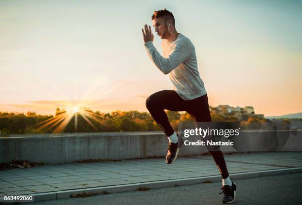 jogging in the morning - center athlete stock pictures, royalty-free photos & images