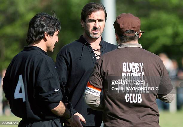 France former football player Eric Cantona talks to a staff member near his brother Joel Cantonna on May 2, 2009 in Argeles-sur-Mer, soutwestern...