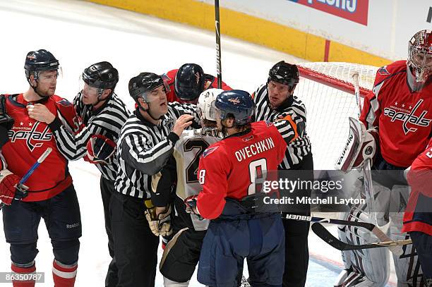 Officials separate members of the Washington Capitals and Pittsburgh Penguins in the third period during Game One of the Eastern Conference...