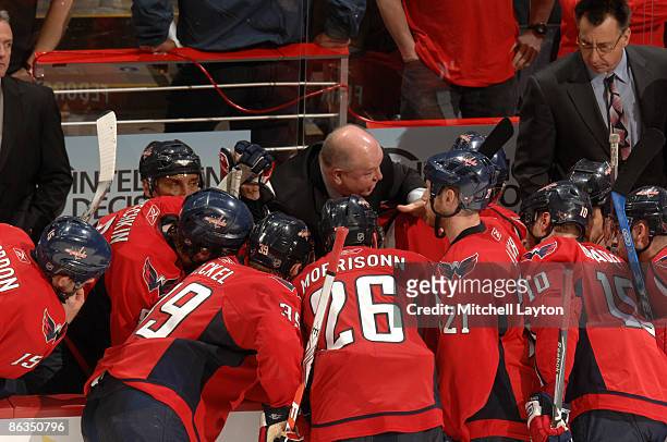 Bruce Boudreau, head coach of the Washington Capitals, gives his team instructions during a timeout during Game One of the Eastern Conference...