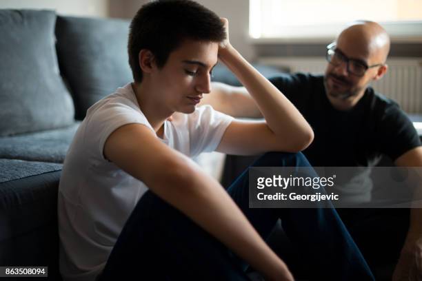 hearing a father's advice - depression sadness stock pictures, royalty-free photos & images