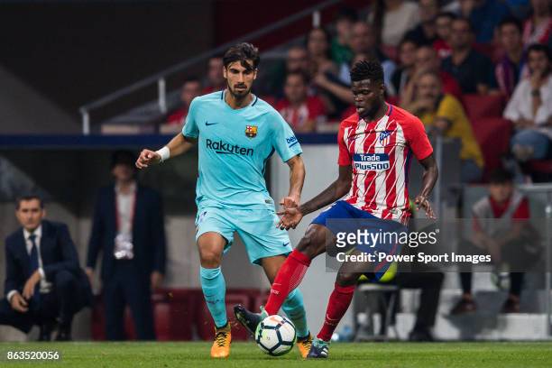 Andre Filipe Tavares Gomes of FC Barcelona fights for the ball with Thomas Teye Partey of Atletico de Madrid during the La Liga 2017-18 match between...