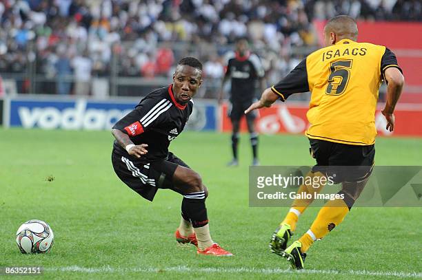 Pirates midfielder Teko Modise and Chiefs defender Dominic Isaacs during the Absa Premiership match between Orlando Pirates and Kaizer Chiefs from...